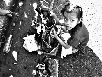 High angle portrait of happy boy playing with outdoors