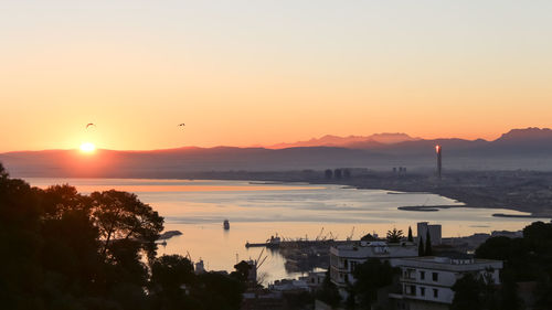 Scenic view of sea against sky during sunset