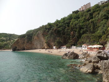 Scenic view of sea and buildings against sky
