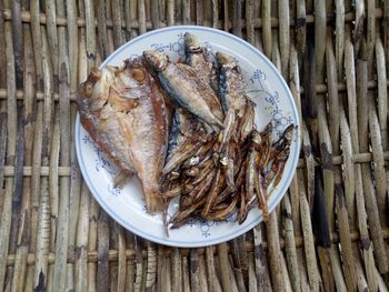 High angle view of fish in plate on table