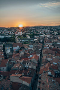 High angle shot of townscape against sky at sunset