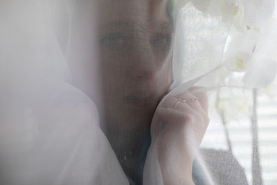 Close-up of hands holding window