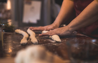 Midsection of person preparing food