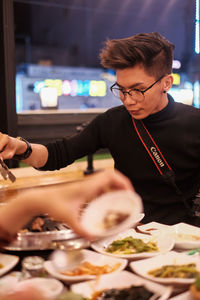 Midsection of woman working at restaurant