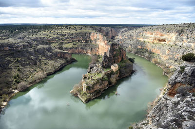 Panoramic view of rock formations against sky