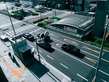 High angle view of cars on road during sunny day in city