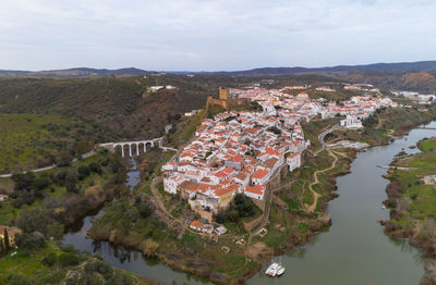Mertola drone aerial view of the city and landscape with guadiana river and castle, in portugal