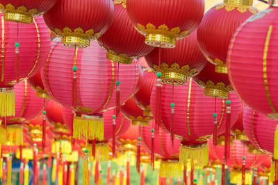 Low angle view of illuminated lanterns hanging at night