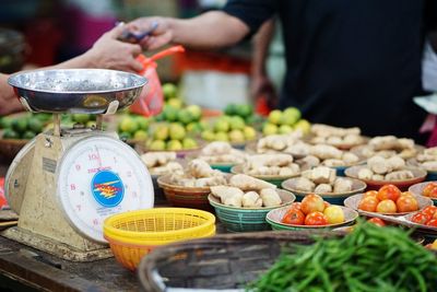 Man preparing food for sale at market stall