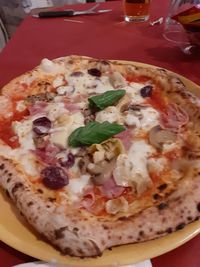 High angle view of pizza in plate on table