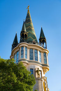 Low angle view of building against blue sky