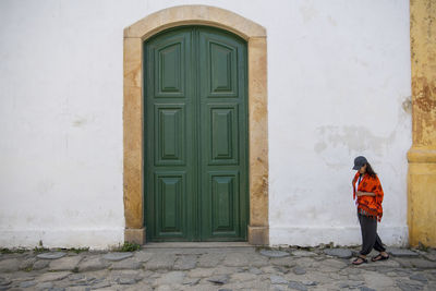 Woman walking through the streets of paraty in brazil