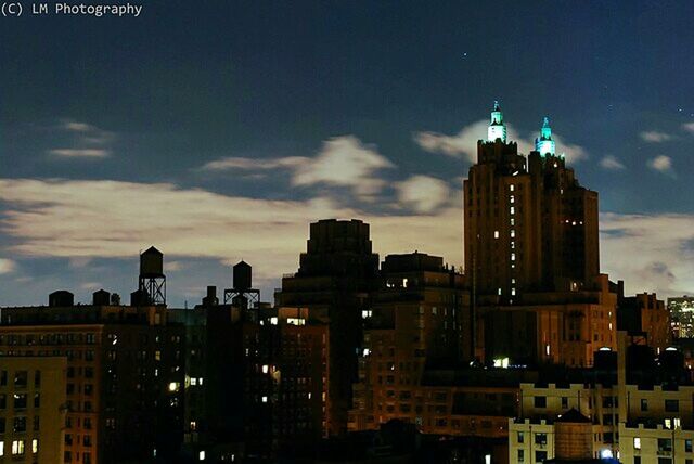 building exterior, architecture, built structure, city, sky, skyscraper, cloud - sky, cityscape, building, sunset, modern, dusk, low angle view, illuminated, tall - high, office building, tower, city life, residential building, urban skyline