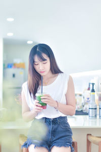 Young woman using mobile phone