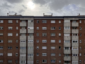 Buildings in city against sky