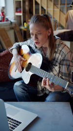 Young man playing guitar