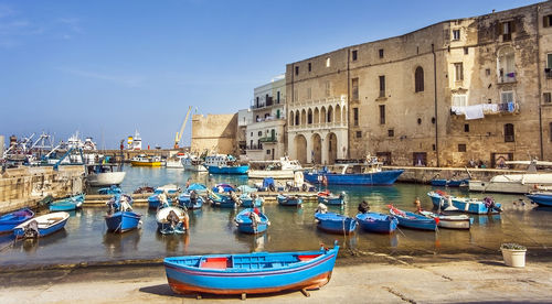 Boats moored at harbor