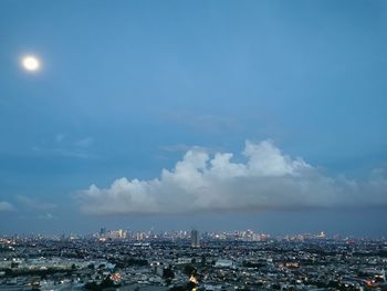 High angle view of city against cloudy sky