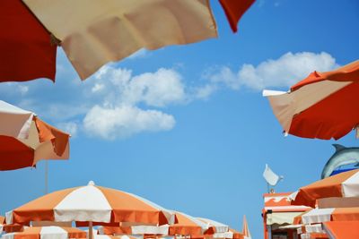 Low angle view of flags against buildings