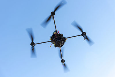 Low angle view of toy against blue sky