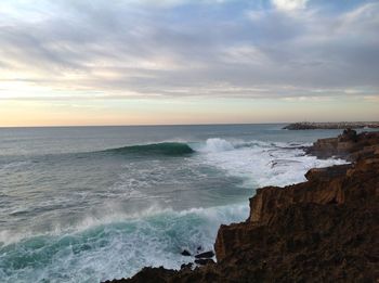 Scenic view of sea against dramatic sky