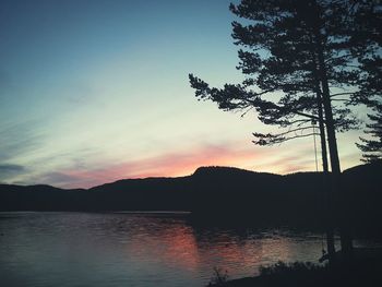 Scenic view of lake at sunset