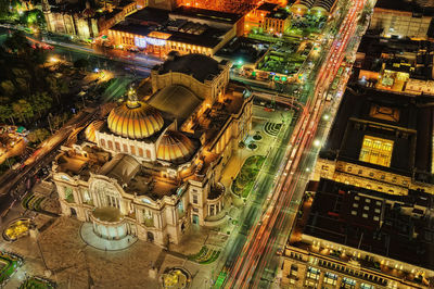 High angle view of illuminated buildings in city at night