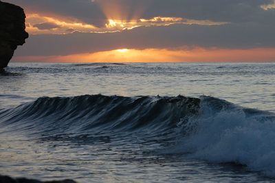 Scenic view of sea against sky at sunset