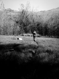 People walking on grassy field