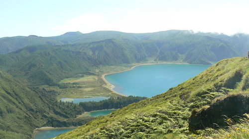 Scenic view of landscape and mountains against sky