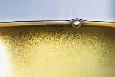 Close-up of yellow glass of water