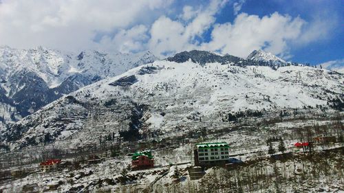 Scenic view of snow covered mountains