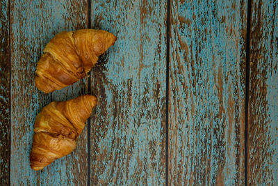 High angle view of leaf on wooden table