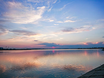 Scenic view of lake against sky during sunset