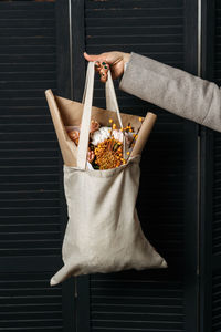 Cropped hand of woman holding gift