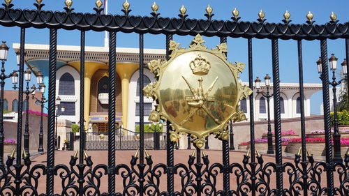 View of metal fence against building