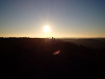 Scenic view of silhouette landscape against sky during sunset