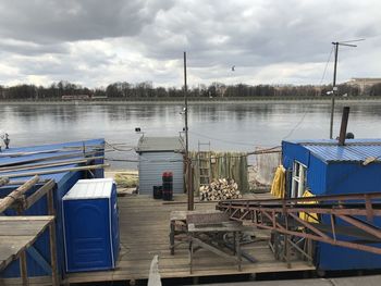 Pier on lake against sky