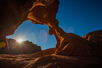 Sunrise in the natural stone arch in the valley of fire.