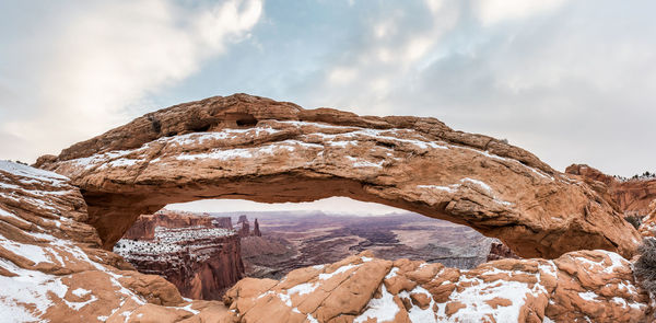 Rock formation against sky during winter