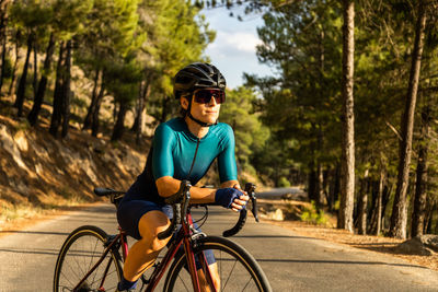 Man riding bicycle on road