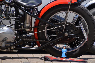 Man standing on motorcycle