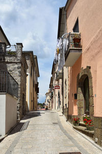 A narrow street between the houses of ruviano, a small village in the province of caserta in italy.