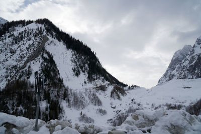 Scenic view of mountains against sky during winter