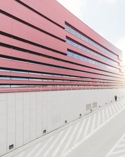 Road by building against sky in city