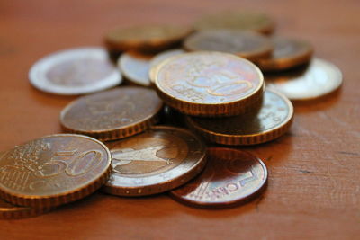 Close-up of coins on table