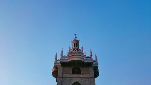 Low angle view of building against clear blue sky