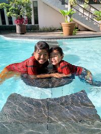 Portrait of happy boy in swimming pool