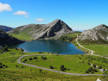 Scenic view of lake and mountains against sky