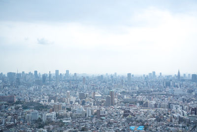 High angle view of buildings against sky in city